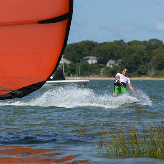 George I. Pare' of True Progression Kiteboarding riding a custom color 2014 Ozone Zephyr on Cape Cod in light wind.
